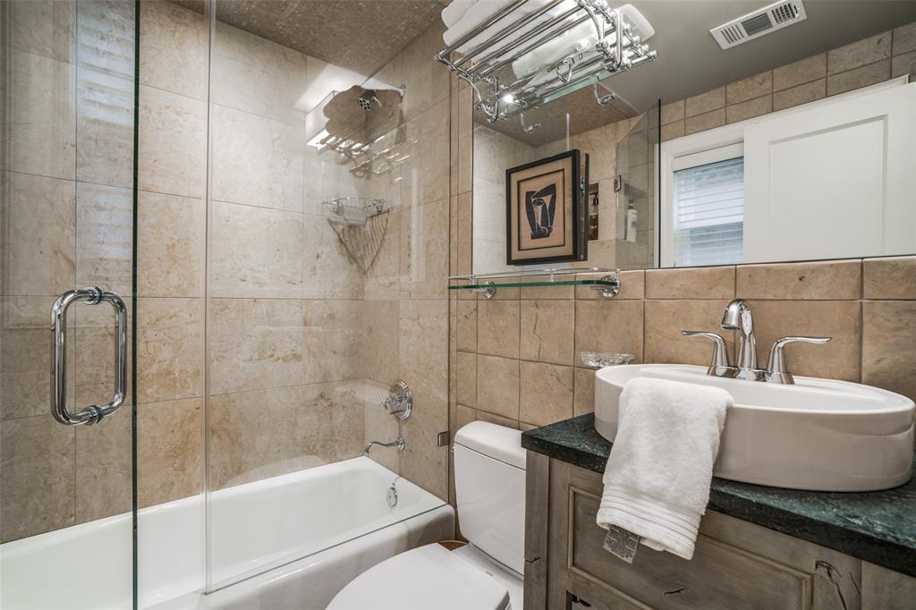3610 Congress Avenue Dallas, TX 75219 - Photo 32 of 40 a bathroom with a sink toilet and shower