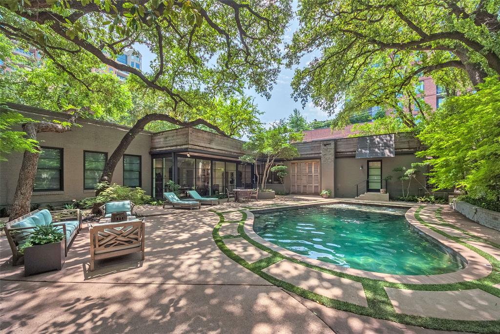 3610 Congress Avenue Dallas, TX 75219 - Photo 39 of 40 a front view of a house with a yard porch and outdoor seating