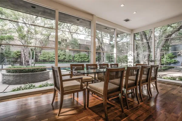 a view of a dining room with furniture window and wooden floor