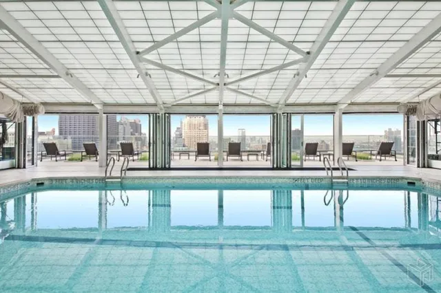 a view of a patio with plants and chairs