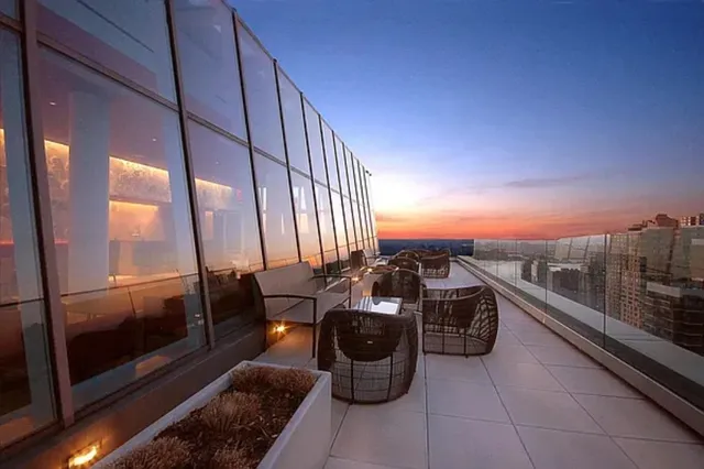 a large white kitchen with a large window