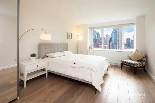 a kitchen with a table chairs stove and cabinets