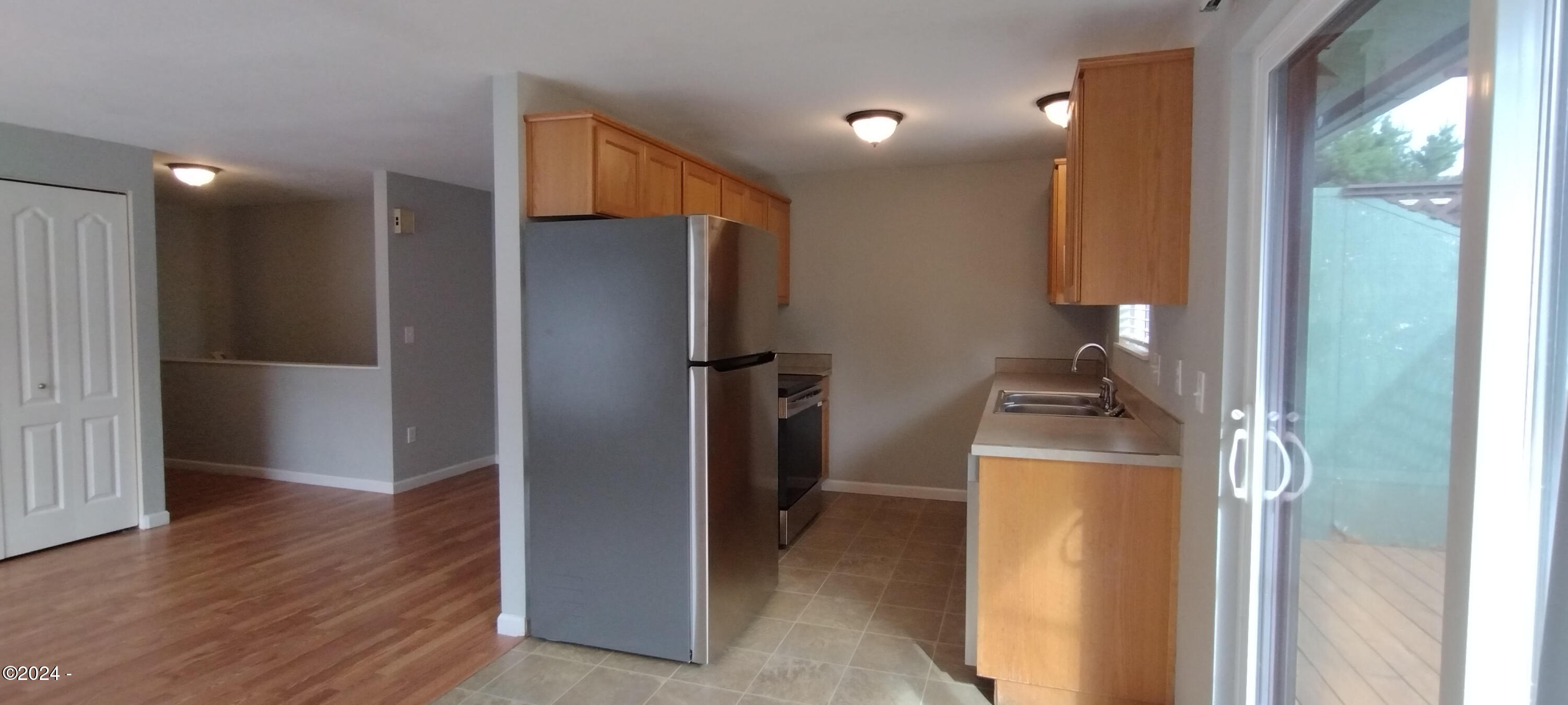 630 Southwest Fall Street Newport, OR 97365 - Photo 6 of 28 Kitchen with Slider to Upper Deck
