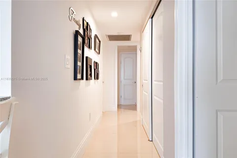 a view of a hallway with a white walls