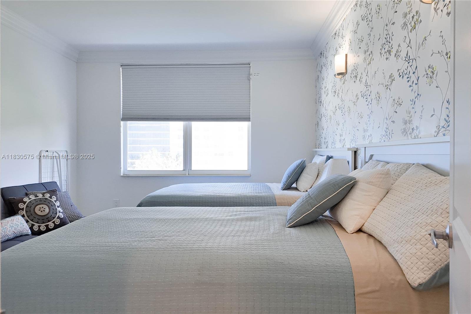 1950 South Ocean Drive, Unit 4E Hallandale Beach, FL 33009 - Photo 21 of 33 a bedroom with a bed and a window