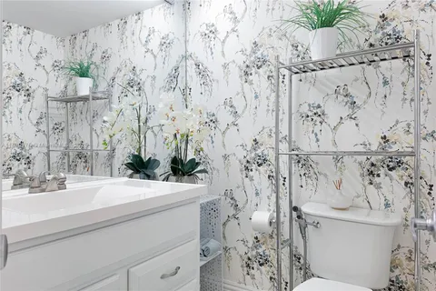 a bathroom with a sink and toilet