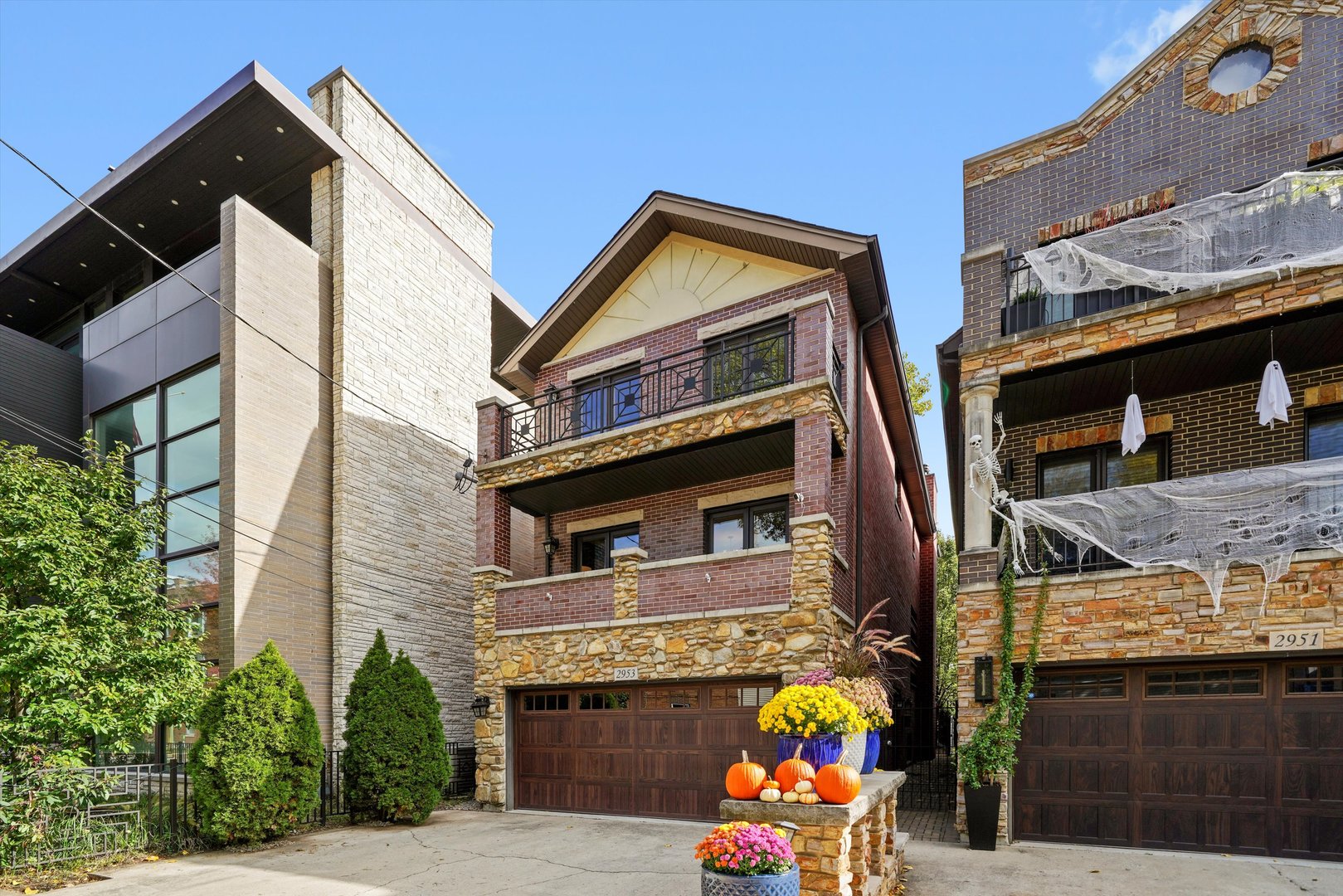 a front view of a house with outdoor seating