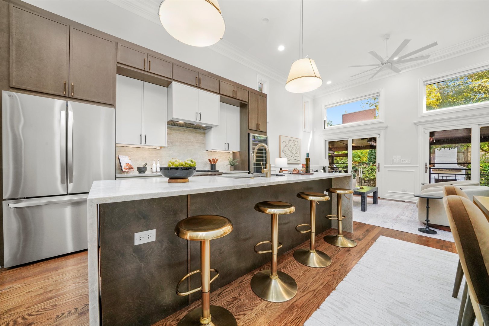 2953 North Honore Street Chicago, IL 60657 - Photo 2 of 40 a kitchen with granite countertop a table chairs stove a refrigerator and cabinets
