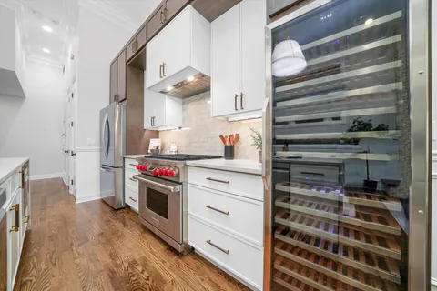a dining room with furniture and wooden floor