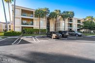 833 Riverside Drive, Unit 835 Coral Springs, FL 33071 - Photo 1 of 25 a front view of a house with a yard