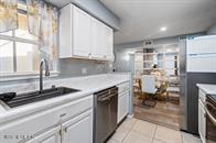 833 Riverside Drive, Unit 835 Coral Springs, FL 33071 - Photo 15 of 25 a kitchen with a sink and cabinets