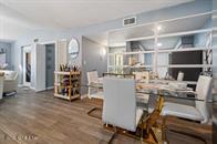 833 Riverside Drive, Unit 835 Coral Springs, FL 33071 - Photo 19 of 25 a room with chairs and a view of kitchen