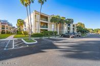833 Riverside Drive, Unit 835 Coral Springs, FL 33071 - Photo 2 of 25 a view of a house with a yard and potted plants