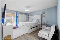 833 Riverside Drive, Unit 835 Coral Springs, FL 33071 - Photo 9 of 25 a bedroom with a bed and a couch