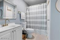 833 Riverside Drive, Unit 835 Coral Springs, FL 33071 - Photo 10 of 25 a bathroom with a sink toilet and shower