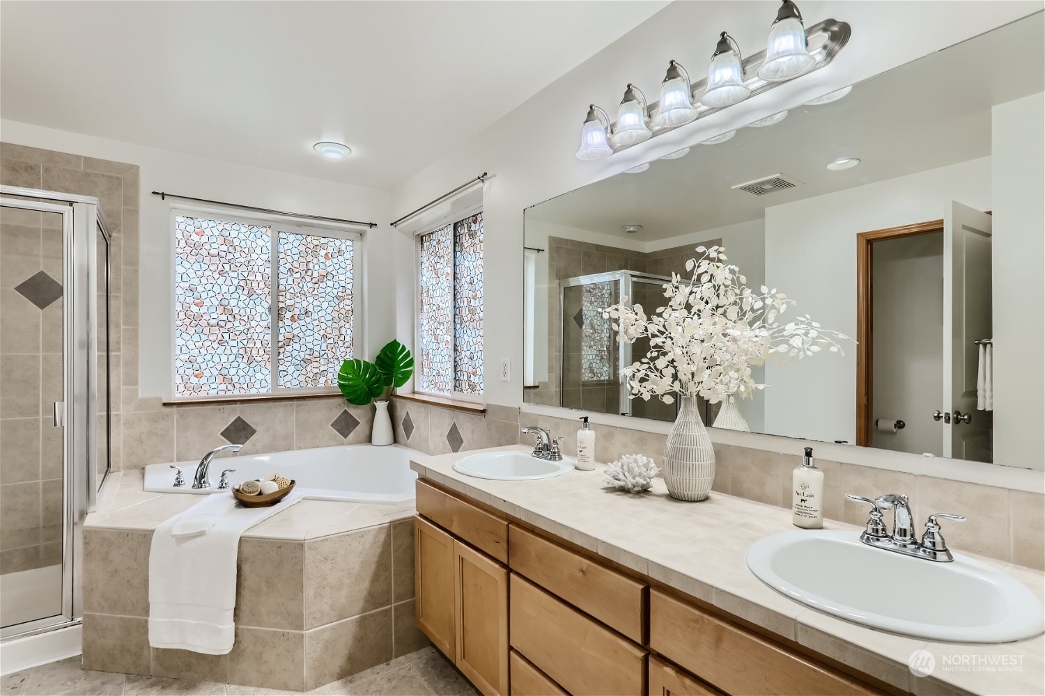 23816 17th Place West Bothell, WA 98021 - Photo 21 of 29 a bathroom with a granite countertop sink and a large mirror