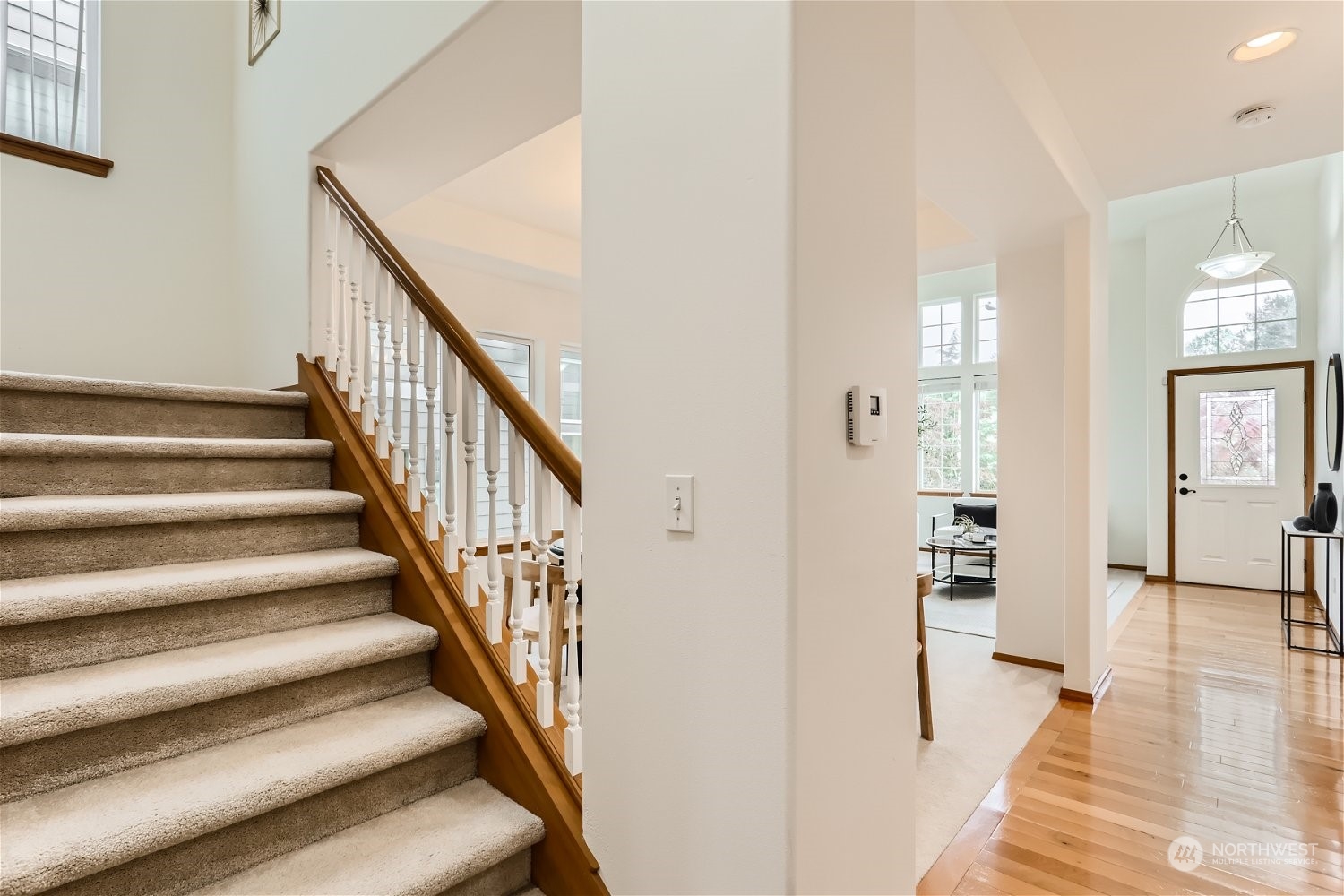 23816 17th Place West Bothell, WA 98021 - Photo 7 of 29 a view of a hallway with wooden floor and staircase