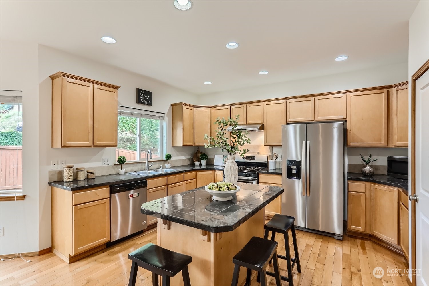 23816 17th Place West Bothell, WA 98021 - Photo 8 of 29 a kitchen with stainless steel appliances granite countertop sink refrigerator and microwave