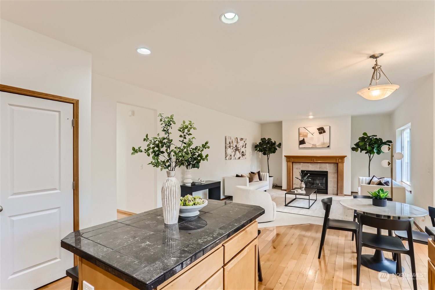 23816 17th Place West Bothell, WA 98021 - Photo 10 of 29 a living room with furniture a fireplace and potted plants