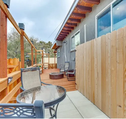 a outdoor space with patio furniture and wooden floor