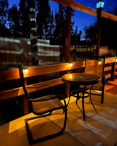 a view of swimming pool with seating area and barbeque vanity