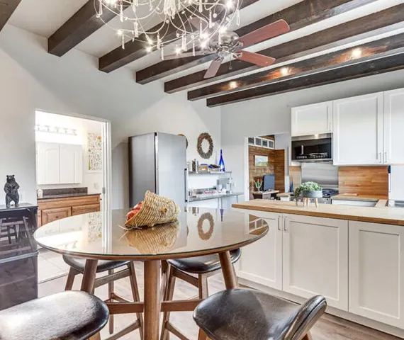 a view of a dining room with furniture and wooden floor