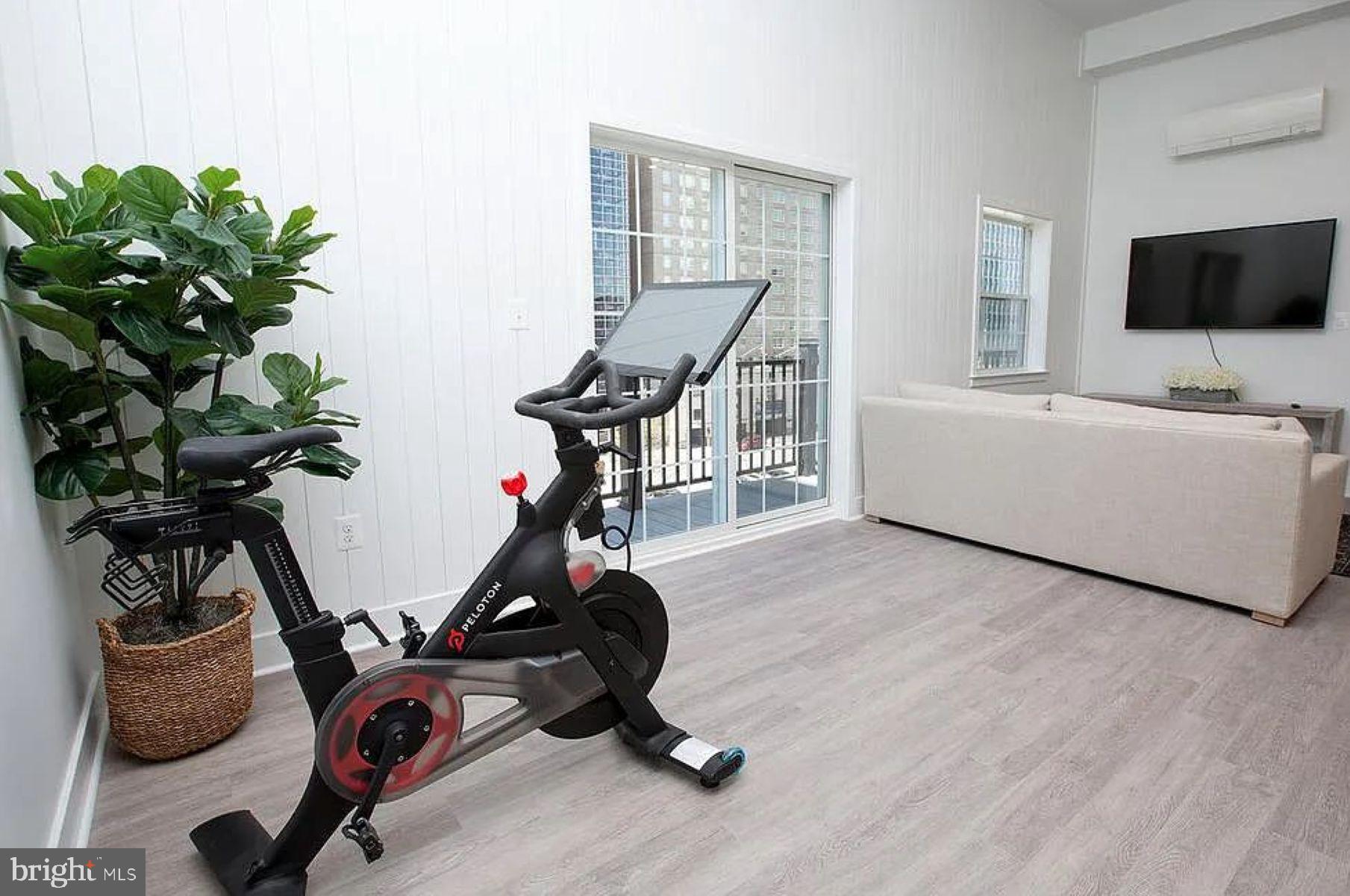 211 St Paul Street, Unit 504 Baltimore, MD 21202 - Photo 7 of 12 Living & Exercise Area - Model Home
