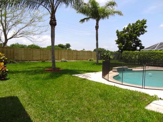 12292 St Simon Drive Boca Raton, FL 33428 - Photo 12 of 15 SPACIOUS YARD BEYOND POOL