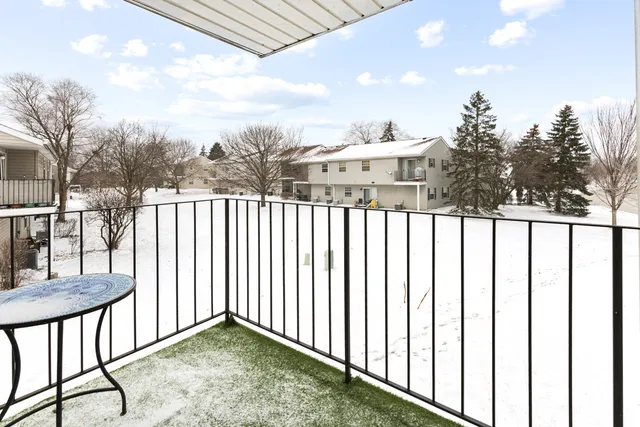 a view of a balcony with wooden fence