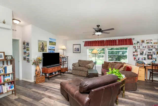 a view of a dining room with furniture window and outside view