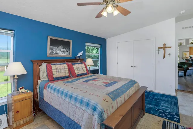 a bathroom with a sink double vanity granite and a mirror