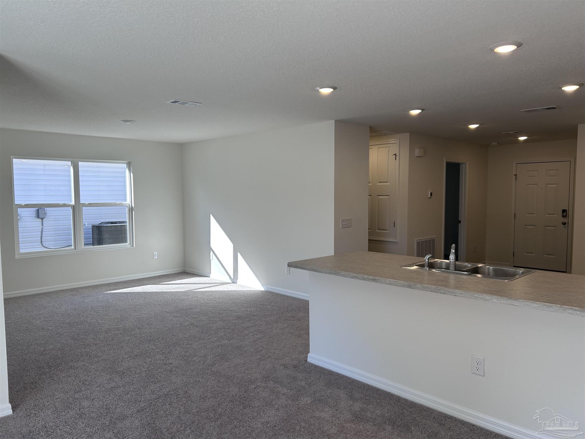 4044 Edgefield Street Pace, FL 32571 - Photo 4 of 4 a bathroom with a sink and a mirror