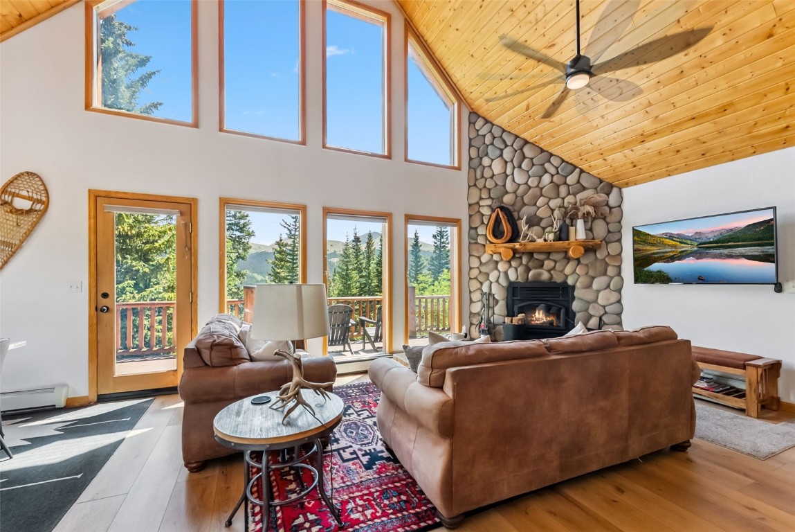 1375 Roberts Road Alma, CO 80420 - Photo 3 of 50 Living room featuring high vaulted ceiling, plenty of natural light, hardwood / wood-style flooring, wood ceiling, and ceiling fan