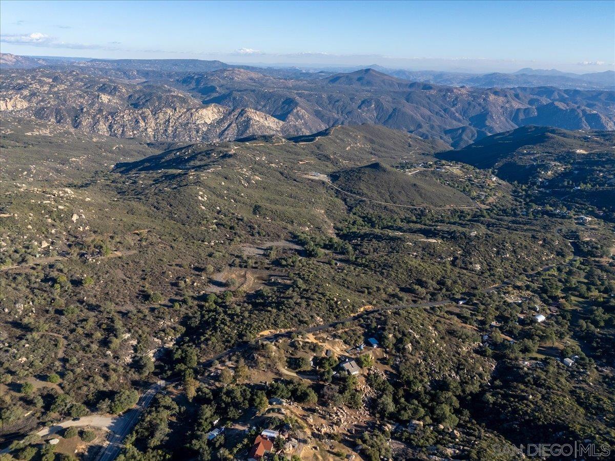 0 Valley Road, Unit A72 Jamul, CA 91935 - Photo 13 of 17 an aerial view of house with yard and mountain in the background