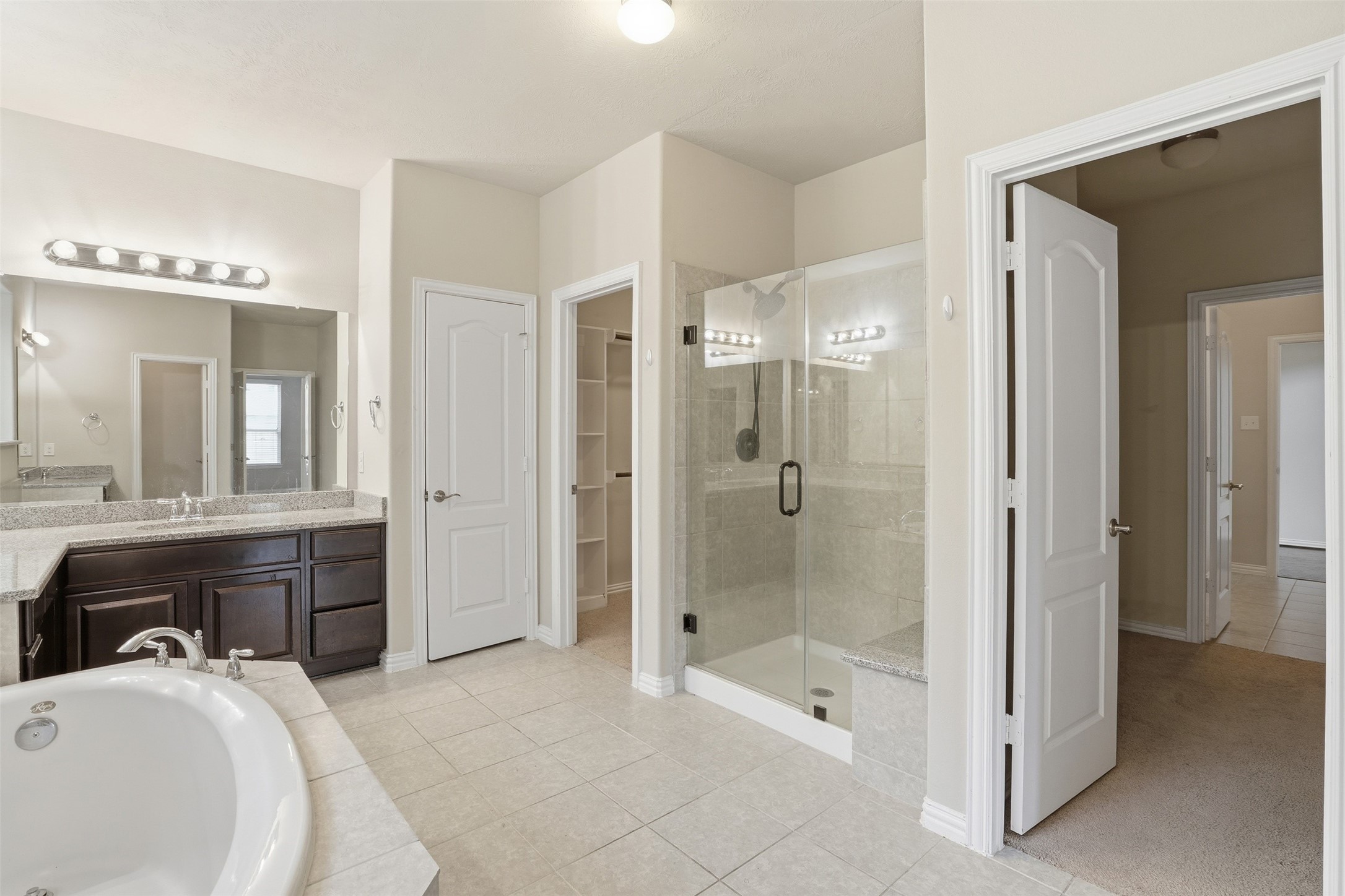 811 River Delta Lane Rosenberg, TX 77469 - Photo 16 of 35 First floor primary has separate shower and garden tub.