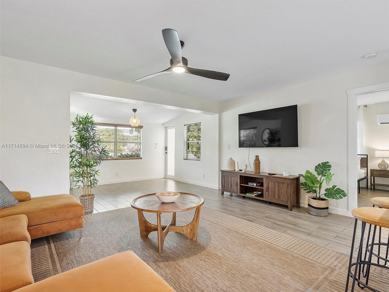 300 Southwest 23rd Street Fort Lauderdale, FL 33315 - Photo 1 of 43 a living room with furniture and a flat screen tv