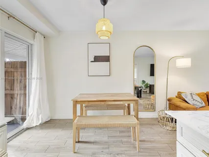 a spacious bathroom with a sink and a mirror