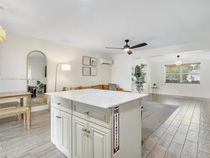 a kitchen with cabinets and appliances