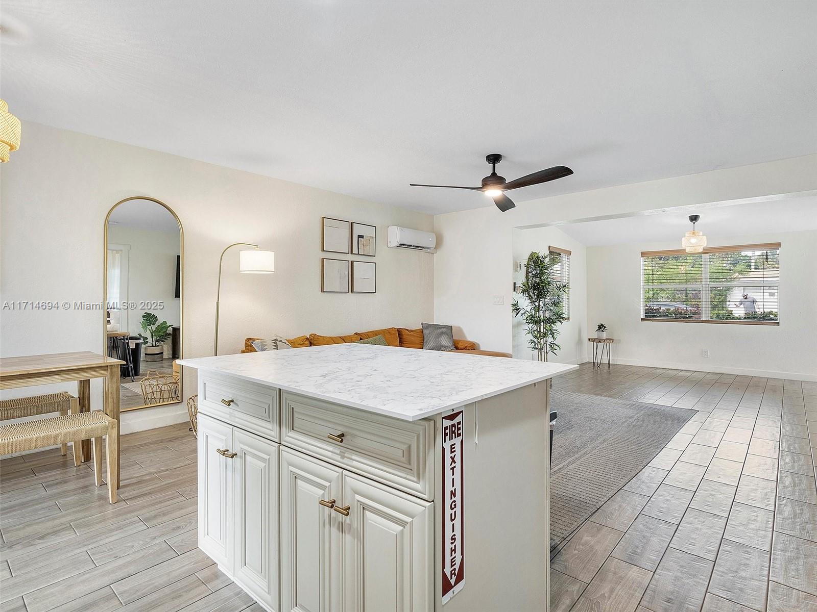 300 Southwest 23rd Street Fort Lauderdale, FL 33315 - Photo 24 of 43 a living room with stainless steel appliances kitchen island granite countertop furniture and a living room view