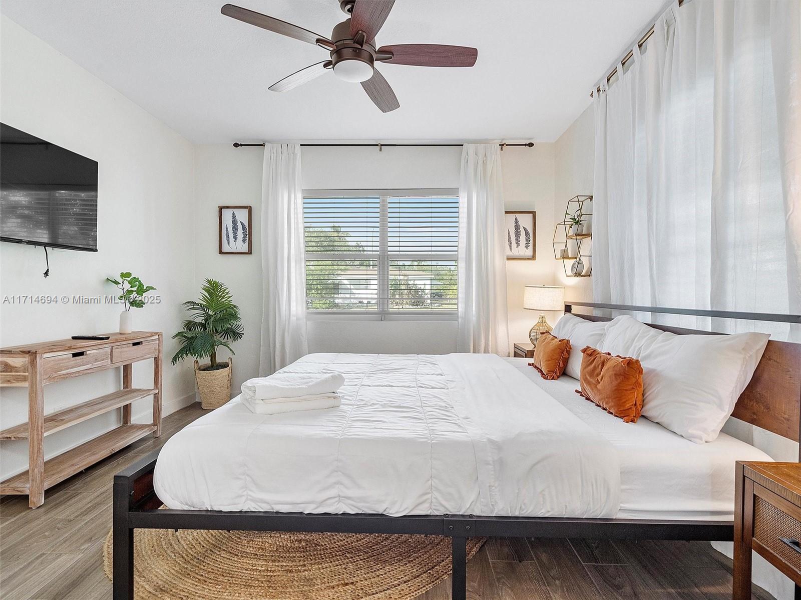 300 Southwest 23rd Street Fort Lauderdale, FL 33315 - Photo 32 of 43 a bedroom with a bed and a flat screen tv