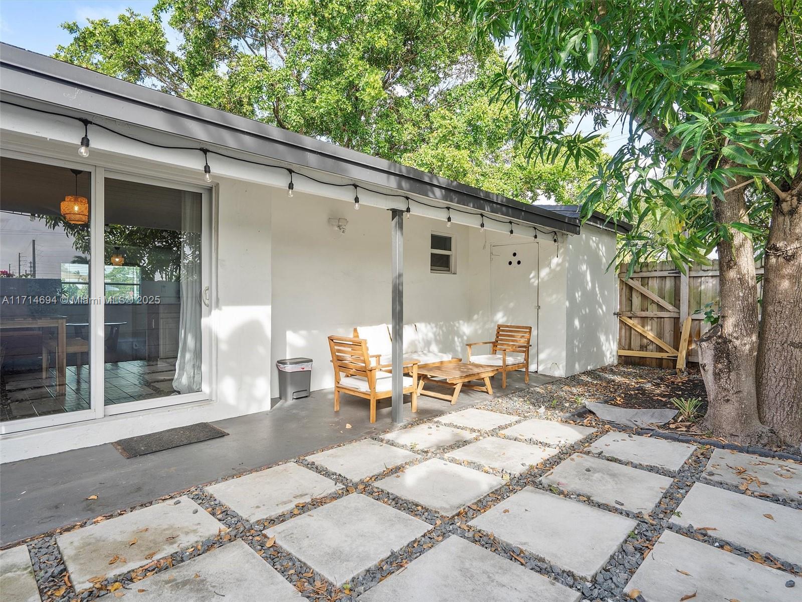 300 Southwest 23rd Street Fort Lauderdale, FL 33315 - Photo 37 of 43 a view of a patio with a table and chairs and couches in a patio