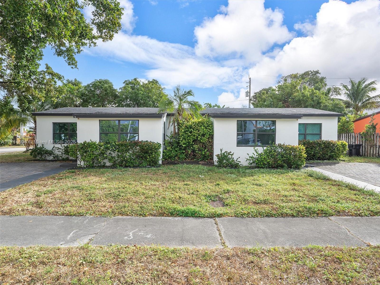 300 Southwest 23rd Street Fort Lauderdale, FL 33315 - Photo 5 of 43 a front view of house with yard and trees around