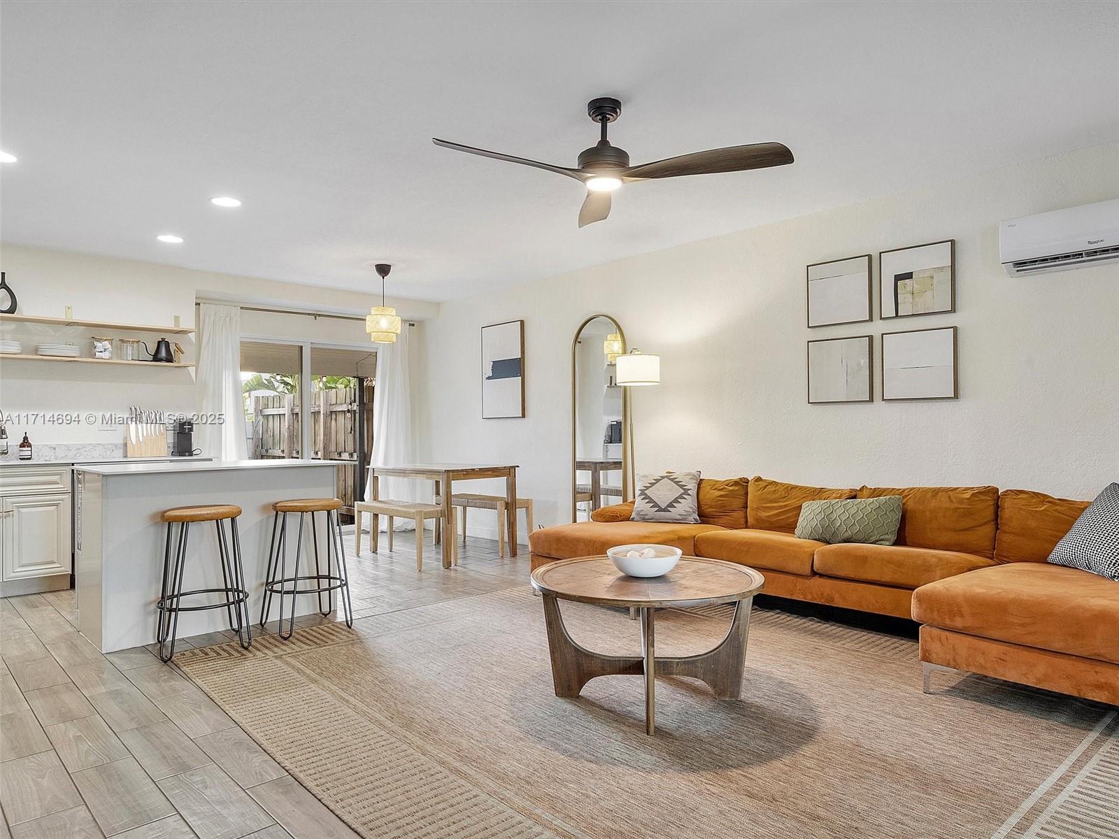 300 Southwest 23rd Street Fort Lauderdale, FL 33315 - Photo 9 of 43 a living room with furniture and a view of kitchen