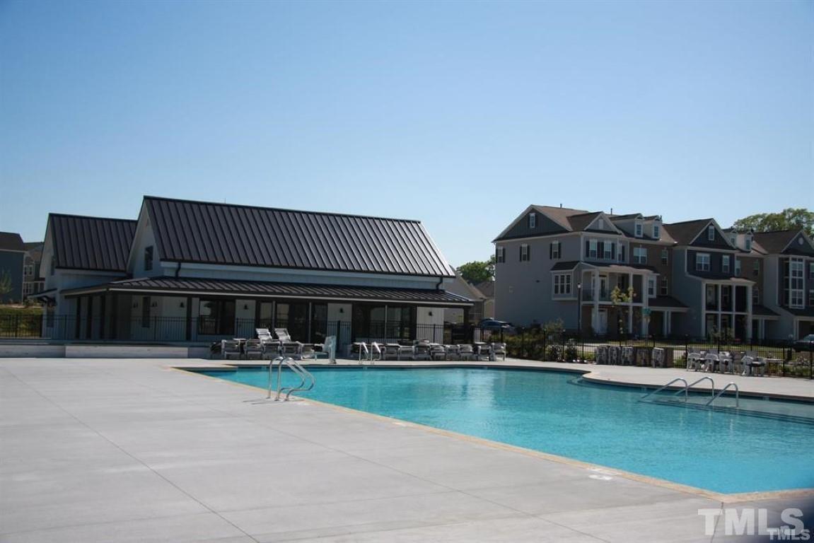 2919 Sunflower Road Apex, NC 27502 - Photo 33 of 34 a view of swimming pool is middle in front of building