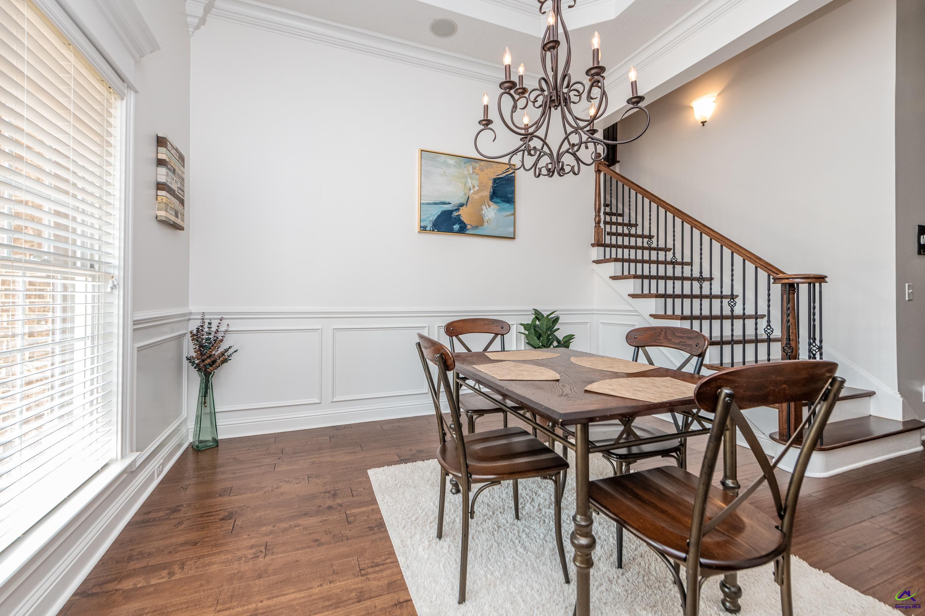 405 Old Bridge Road Warner Robins, GA 31088 - Photo 7 of 58 a view of a dining room with furniture and chandelier