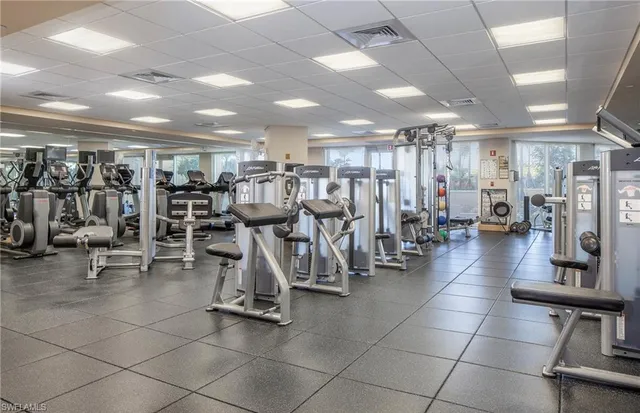 a tennis court with outdoor seating