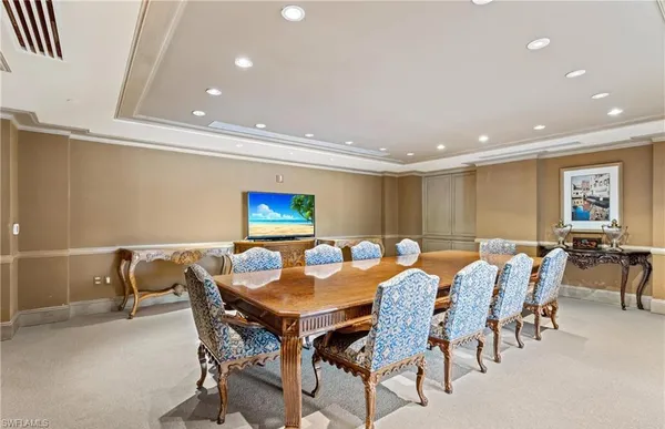 a room with pool table and window