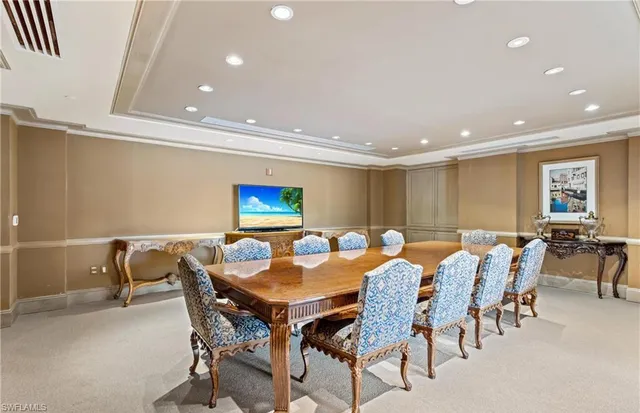 a room with pool table and window