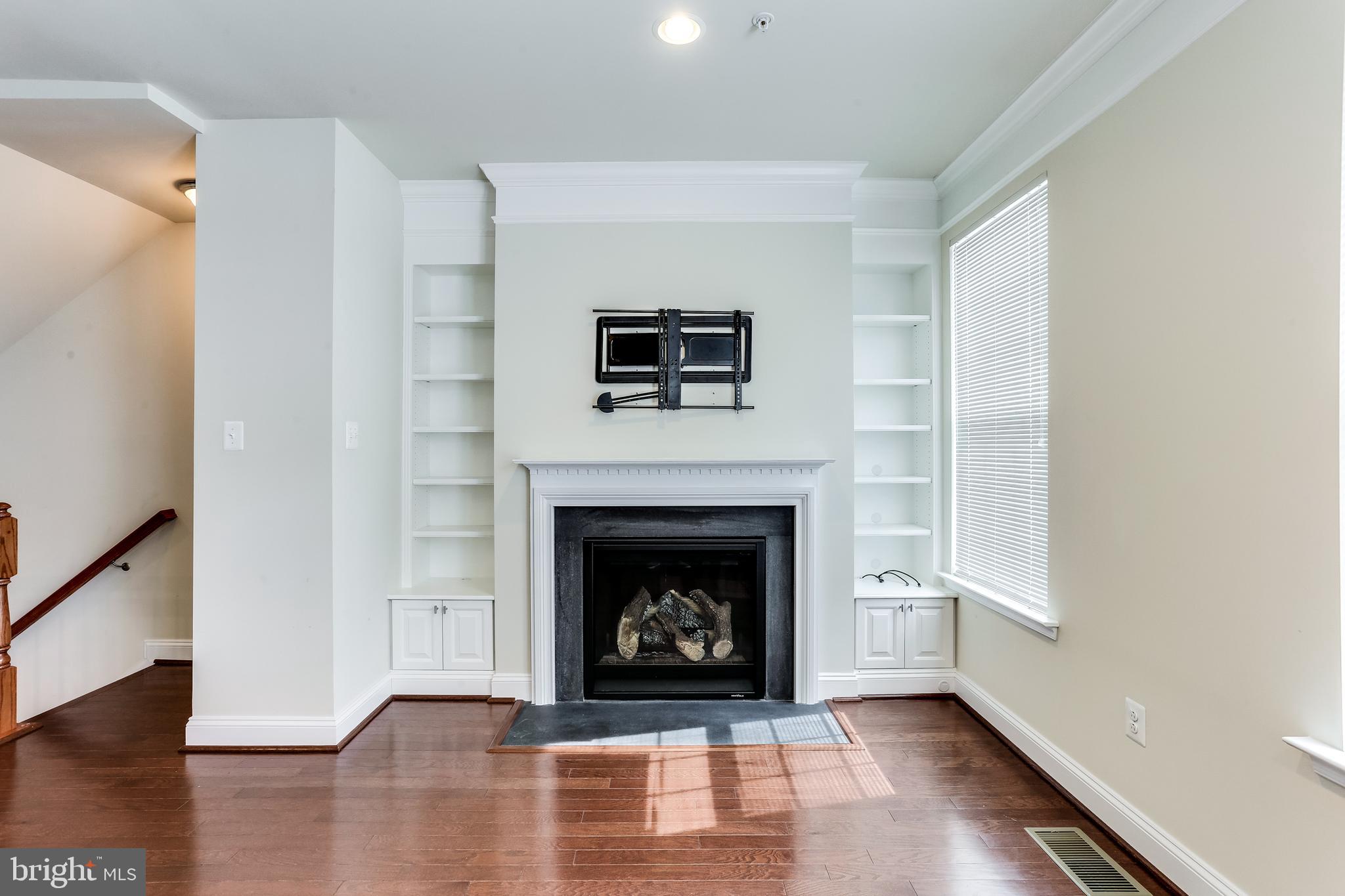5796 Richards Valley Road Ellicott City, MD 21043 - Photo 11 of 42 Built-in Cabinetry alongside fireplace