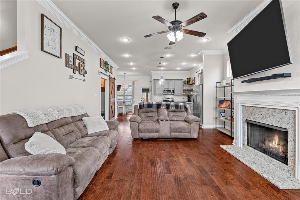 946 Maize Street Bossier City, LA 71111 - Photo 18 of 39 a living room with furniture fireplace and flat screen tv